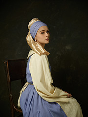 Image showing Medieval Woman in Historical Costume Wearing Corset Dress and Bonnet.