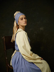 Image showing Medieval Woman in Historical Costume Wearing Corset Dress and Bonnet.