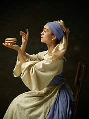 Image showing Medieval Woman in Historical Costume Wearing Corset Dress and Bonnet.