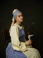 Image showing Medieval Woman in Historical Costume Wearing Corset Dress and Bonnet.