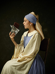 Image showing Medieval Woman in Historical Costume Wearing Corset Dress and Bonnet.