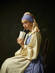 Image showing Medieval Woman in Historical Costume Wearing Corset Dress and Bonnet.