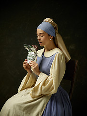 Image showing Medieval Woman in Historical Costume Wearing Corset Dress and Bonnet.