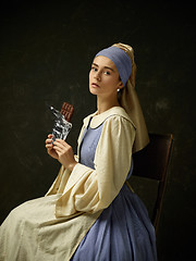 Image showing Medieval Woman in Historical Costume Wearing Corset Dress and Bonnet.