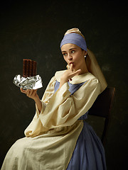 Image showing Medieval Woman in Historical Costume Wearing Corset Dress and Bonnet.