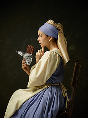 Image showing Medieval Woman in Historical Costume Wearing Corset Dress and Bonnet.