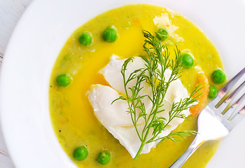 Image showing Fresh soup from green peas and egg-poached