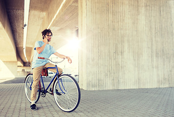 Image showing man with smartphone and fixed gear bike on street