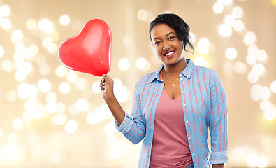 Image showing african american woman with heart-shaped balloon