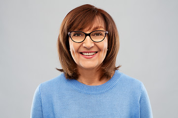 Image showing portrait of senior woman in glasses over grey