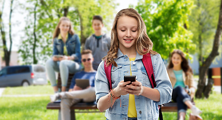 Image showing teen student girl with school bag and smartphone