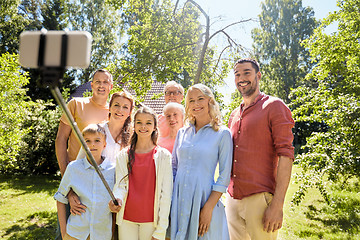 Image showing happy family taking selfie in summer garden