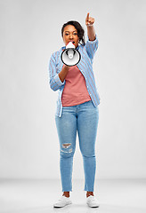 Image showing happy african american woman over grey background