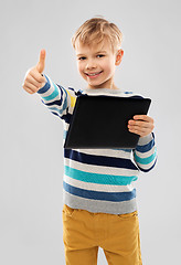 Image showing smiling boy with tablet computer showing thumbs up