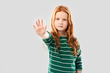 Image showing red haired girl showing stop gesture