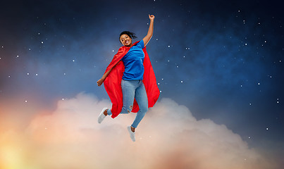 Image showing happy african american woman in superhero red cape