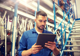 Image showing auto mechanic or smith with tablet pc at workshop