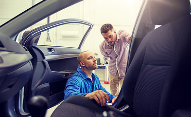 Image showing auto mechanic and man at car shop