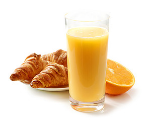 Image showing glass of orange juice and croissants