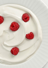 Image showing plate of greek yogurt with raspberries