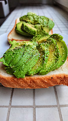 Image showing Sliced avocado on toast