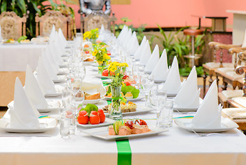 Image showing Long served table with dishes