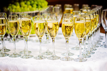 Image showing Glasses of champagne waiting for guests, rustic toned