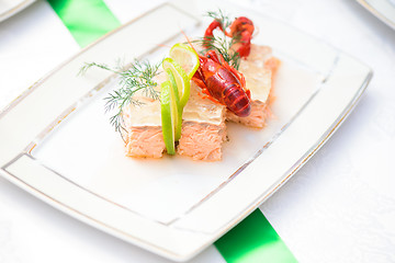 Image showing Fish dish with slice of lime, jelly and crayfish