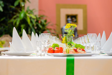 Image showing Long served table with dishes