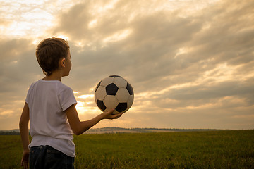 Image showing Portrait of a young  boy with soccer ball.