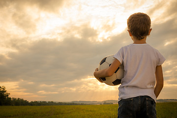 Image showing Portrait of a young  boy with soccer ball.