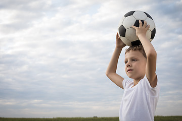 Image showing Portrait of a young  boy with soccer ball. 