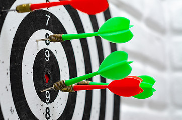 Image showing Darts stick out in round target in dartgame game