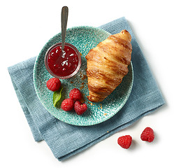 Image showing freshly baked croissant on blue plate