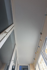 Image showing White matte stretch ceiling on the balcony