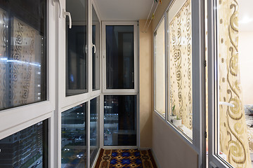 Image showing Glazed to the low of a small balcony, on the floor of the mat