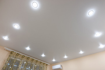 Image showing Stretch ceiling with built-in fixtures in a large room