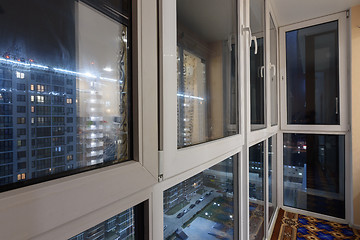 Image showing Plastic Windows, glazed balcony, on the street the night