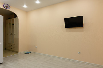 Image showing Empty wall and TV on it in the interior of the large room