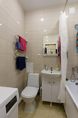 Image showing The uncoupled elements in the interior of a small combined bathroom