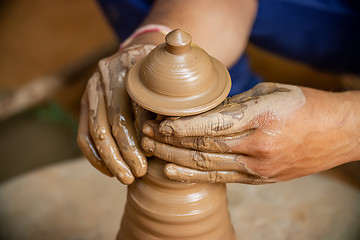 Image showing Potter at work makes ceramic dishes. India, Rajasthan.