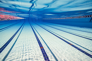 Image showing Olympic Swimming pool under water background.