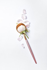 Image showing Golden long spoon with rose flower.