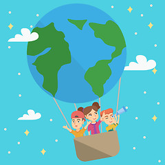 Image showing Cheerful caucasian kids riding a hot air balloon.