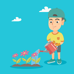 Image showing Caucasian boy watering flowers in the garden.