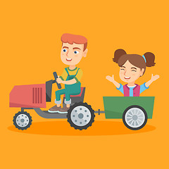 Image showing Boy driving a tractor with his friend in trailer.