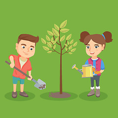 Image showing Little caucasian boy and girl planting the tree.