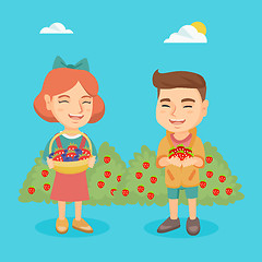 Image showing Little boy and girl with strawberry and blueberry.