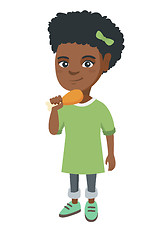 Image showing African-american girl eating roasted chicken leg.