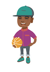 Image showing Laughing schoolboy holding a basketball ball.